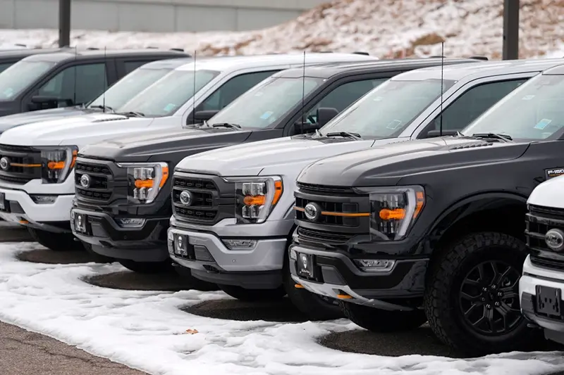 Unsold 2024 F150 pickup trucks sit in a long row at a Ford dealership Sunday, Jan. 21, 2024, in Broomfield, Colo. (AP Photo/David Zalubowski, File)