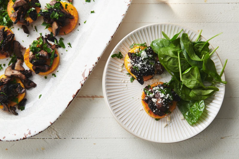 This image shows a recipe for pan fried polenta with sauteed mushrooms. (Cheyenne M. Cohen via AP)