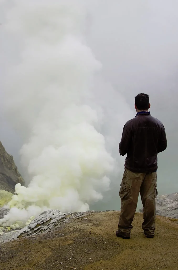 Host Jonathan Legg overlooking steam in a canyon.