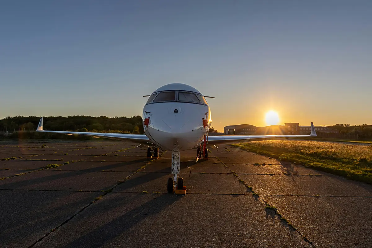 Private Jet at Sunset on Runway. Photo by Joerg Mangelsen.