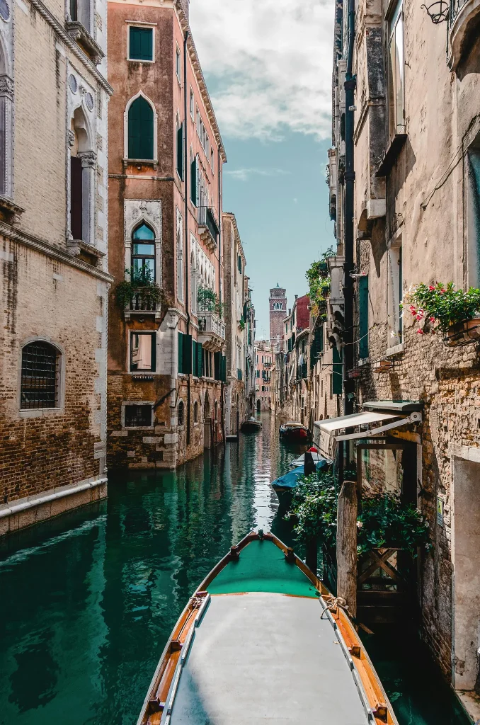 Gray and Brown Boat Traveling on Man-made River. Photo by David Bartus.